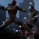 A Gotham Knights screenshot showing playable character Red Hood about to punch a Gotham City goon's lights out.
